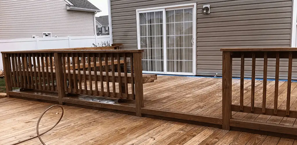 Deck sealing service protecting a backyard wood deck and railings in Austin, TX