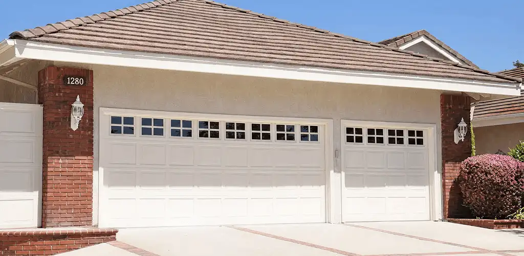 Residential garage door repair service for a double garage door in Austin, TX