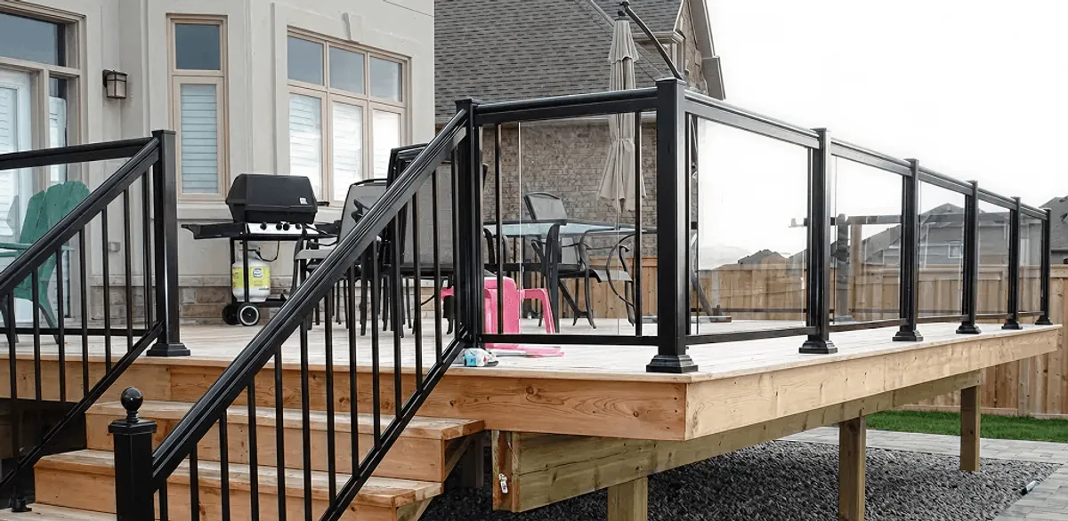 Handrail installation on a deck staircase for safety and code compliance in Austin, TX