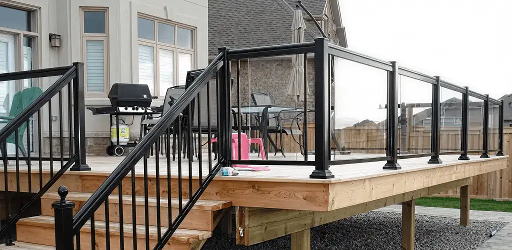 Handrail installation on a deck staircase for safety and code compliance in Austin, TX
