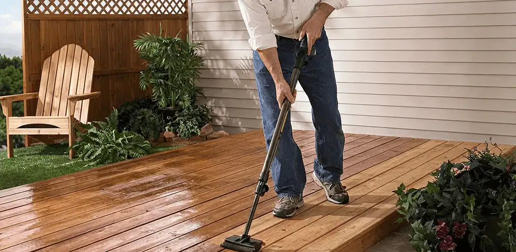 Deck staining service applying stain to a backyard wood deck in Austin, TX